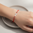 Red String Bracelet on Model Hand